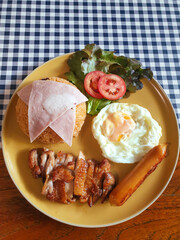 American fried rice, Thai menu composed of tomato sauce fried rice with fried chicken, bologna, sausage and fried egg.