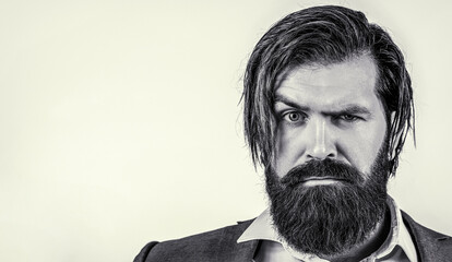 Portrait of handsome bearded man in suit. Male beard and mustache. Sexy male, brutal macho,...