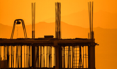 Building under construction at sunset