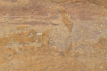 brown stone texture The surface is rough and has signs of peeling off of the rock face. brown stone background abstract background.
