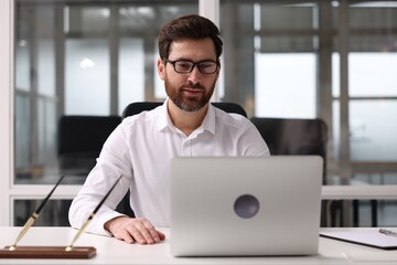 Portrait of serious man in office. Lawyer, businessman, accountant or manager