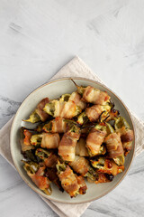 Homemade Bacon-Wrapped Jalapeno Poppers on a Plate, top view. Copy space.