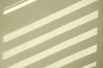 Lines made of light and shadows on white wall