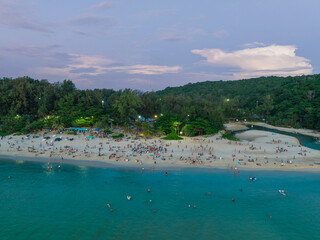 Fototapeta na wymiar beach with sky, clouds and people in Phuket, Thailand 