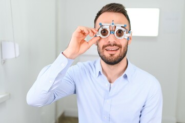 man checking up vision with special ophthalmic glasses