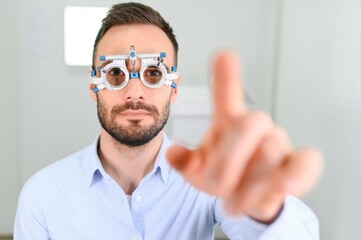 man checking up vision with special ophthalmic glasses