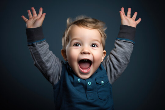 Cute todler laughs loudly and jumps with happiness