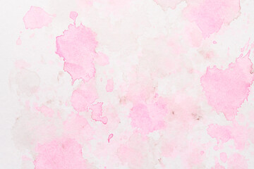 Abstract liquid art background. Pink watercolor translucent blots on white paper
