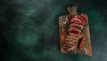  Beef steak meat at wooden cutting board, Menu, recipe mock up, banner. copy space for text. top view © Надія Коваль