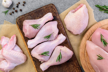 Raw chicken meat on gray background.