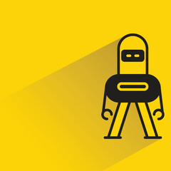 robot with shadow on yellow background