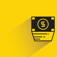 dollar banknote with shadow on yellow background
