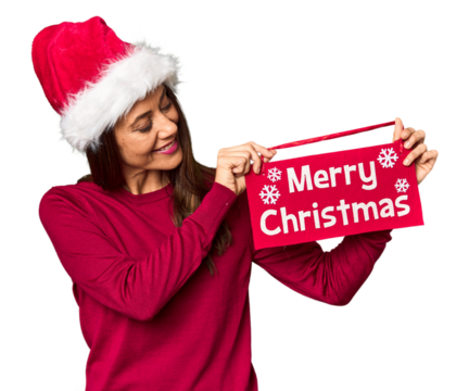 Middle-aged Caucasian woman with Christmas sign in studio - Powered by Adobe