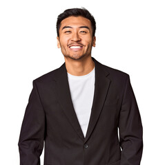 Young Chinese man in business suit in studio happy, smiling and cheerful.