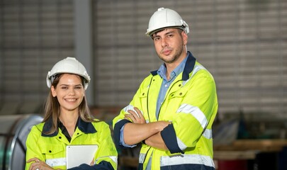 Young men and women engineer supervisor leader and worker with helmet standing smile and hand Cross...