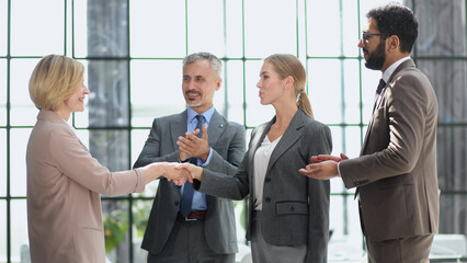 Businessman shaking hands to seal a deal with his partne