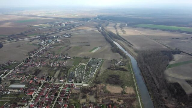 Drone flight above small town Bac, Serbia in cloudy day