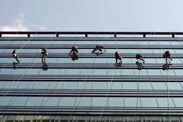 Professional window cleaning working in tower business center
