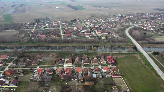 Aerial view of residential area of small town Bac with canal in the middle
