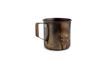 A camping mug made of stainless steel, fired and smoked over a fire or campfire. With the handle on the left. On a white background.Isolated on a white background.