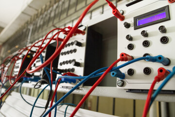 Electronic and magnetic panel with blue and red wires.