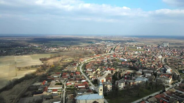 Sun shining through the clouds on town Bac, Serbia viewed from above