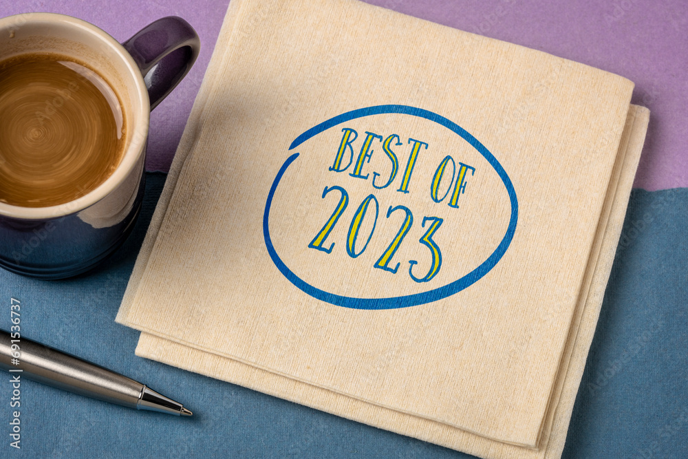 Poster best of 2023 -  handwriting on a napkin with a cup of coffee, product or business review of the recent year