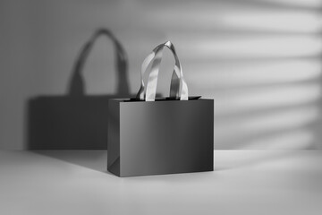 Black paper glossy shopping bag mockup with white handles.