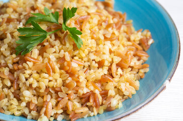 Traditional delicious Turkish food, bulgur pilaf with vermicelli (Turkish name; arpa sehriyeli bulgur pilavi)