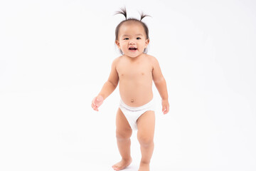 Happy Smiling asian toddler practice walk stand over isolated on white background Baby girl wear diapers It is her first step Toddler girl get funny hairdo Advertising template for children's product 