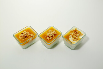 Qamar Al Din Muhalabiya or apricot milk pudding toping with peanut served in dish isolated on table...