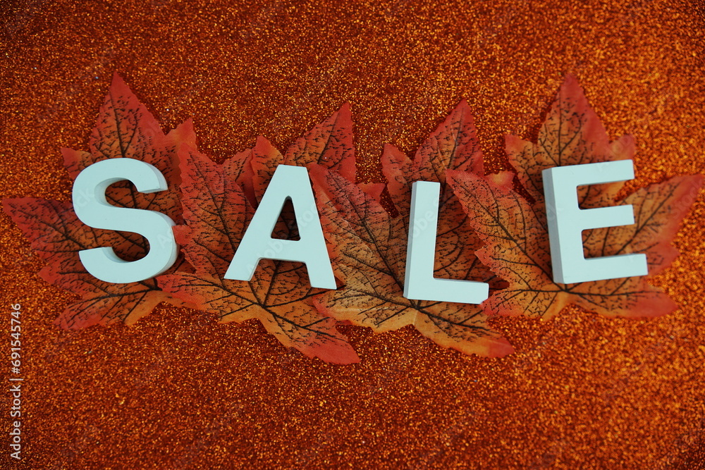 Sticker Sale alphabet letters with maple leaf Autumn and fall season promotion concept background