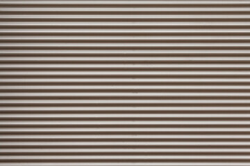 Background of gray sheet metal ribbed horizontally and parallel lines.