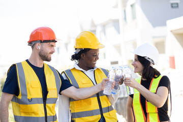 Healthy worker engineer team thirsty drinking clean water in hot temperature weather summer season...