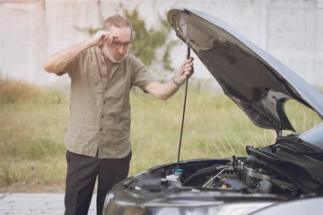 Fotobehang Senior elderly male car broken have a trouble engine fail alone nobody help open hood for self checking on road side. © Quality Stock Arts
