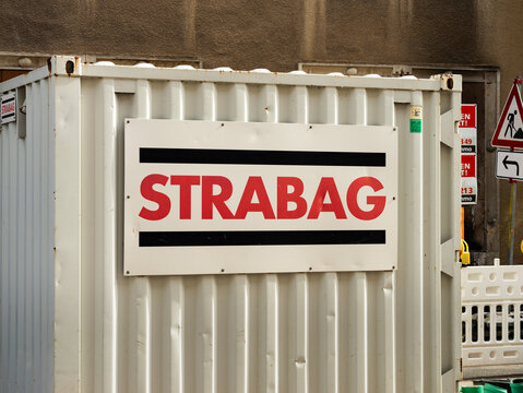 MEISSEN, GERMANY - 21. June 2023: Strabag logo sign on a container at a construction site. The company is building infrastructure like roads and streets in Europe. Civil engineering as a business.