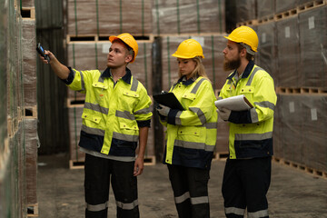 Team Caucasian businessman and businesswoman checking stock with bar code scanner