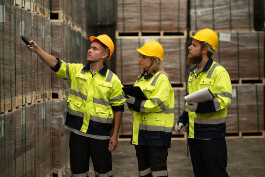 Team Caucasian businessman and businesswoman checking stock with bar code scanner