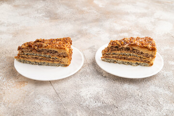 Walnut and hazelnut cake with caramel on brown concrete. side view