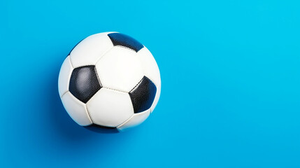 Fototapeta na wymiar Soccer ball on blue background