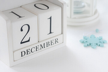 21 th December. White block calendar presents date 21 and month December, website events.  Winter decoration concept. Winter days.