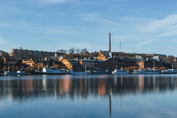 buildings in the morning light with water reflection in stockholm