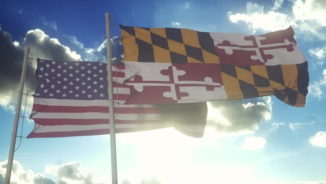 The Maryland state flags waving along with the national flag of the United States of America. In the background there is a clear sky