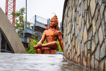 hindu god lord shiva isolated statue with bright background at morning from different perspective