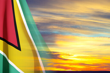 Guyana flag against the sunset. Patriotic background