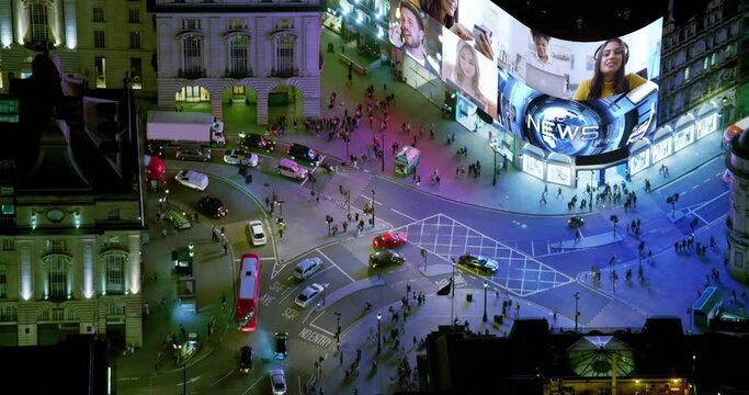 Aerial View of Famous Video Display in London Piccadilly Circus, United Kingdom. All videos Included in my Portfolio.  Regent Street and Shaftesbury Avenue Full of People and Traffic. 
