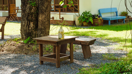 Chairs and table in an outdoor summer garden. garden chairs outside in the garden with lots of trees. Rest in the garden. Cottage with garden. Vacation at home