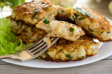 cooked vegetarian fried cauliflower cutlets in a plate