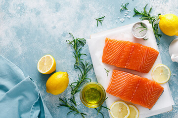 Salmon. Fresh raw salmon fish fillet with cooking ingredients, herbs and lemon, top view