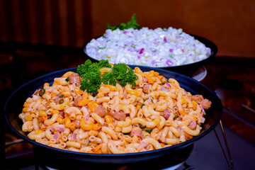 A Fresh mixed salad with macaroni close up